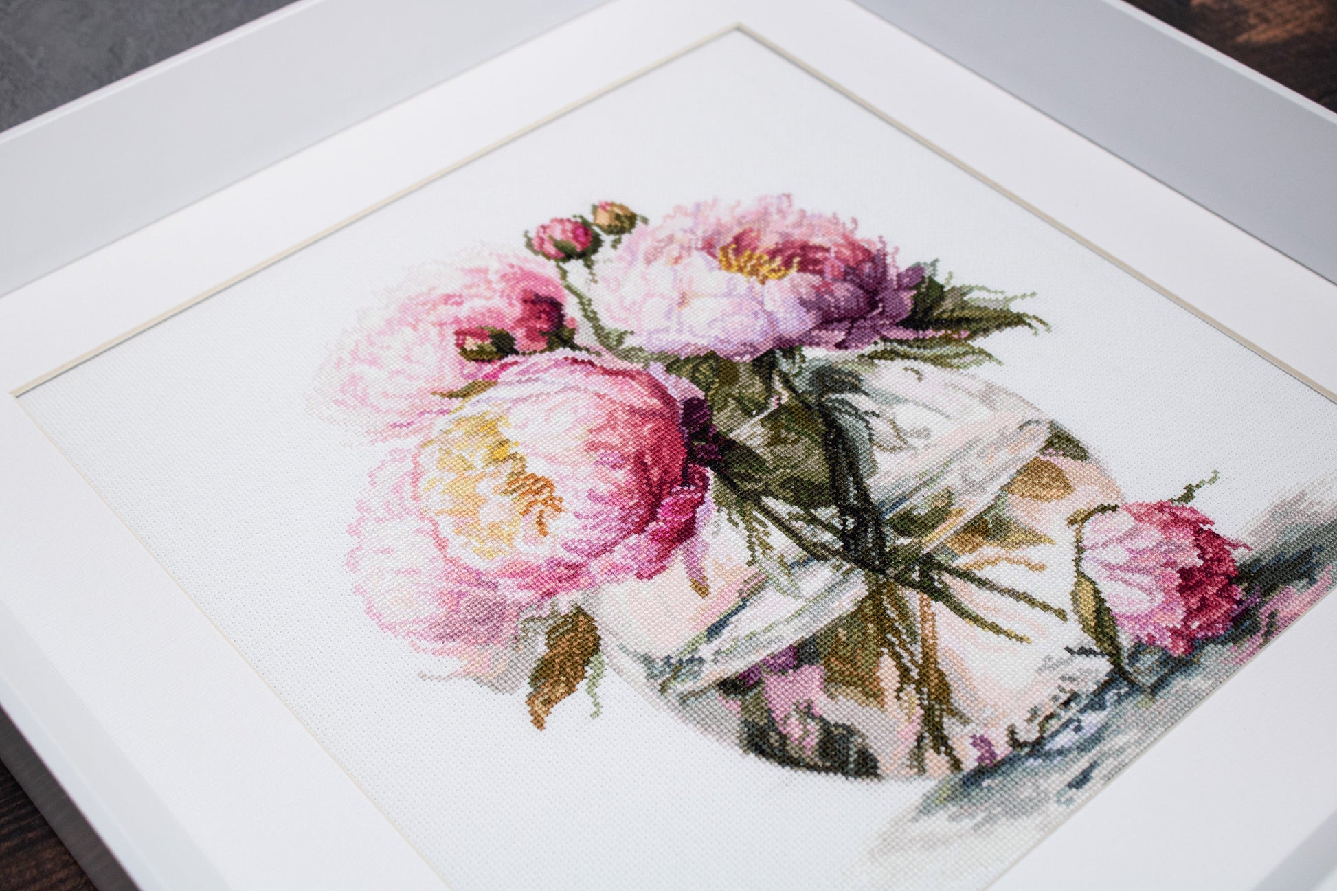 Luca-S Bouquet of Peonies B7028 framed cross stitch artwork at an angle