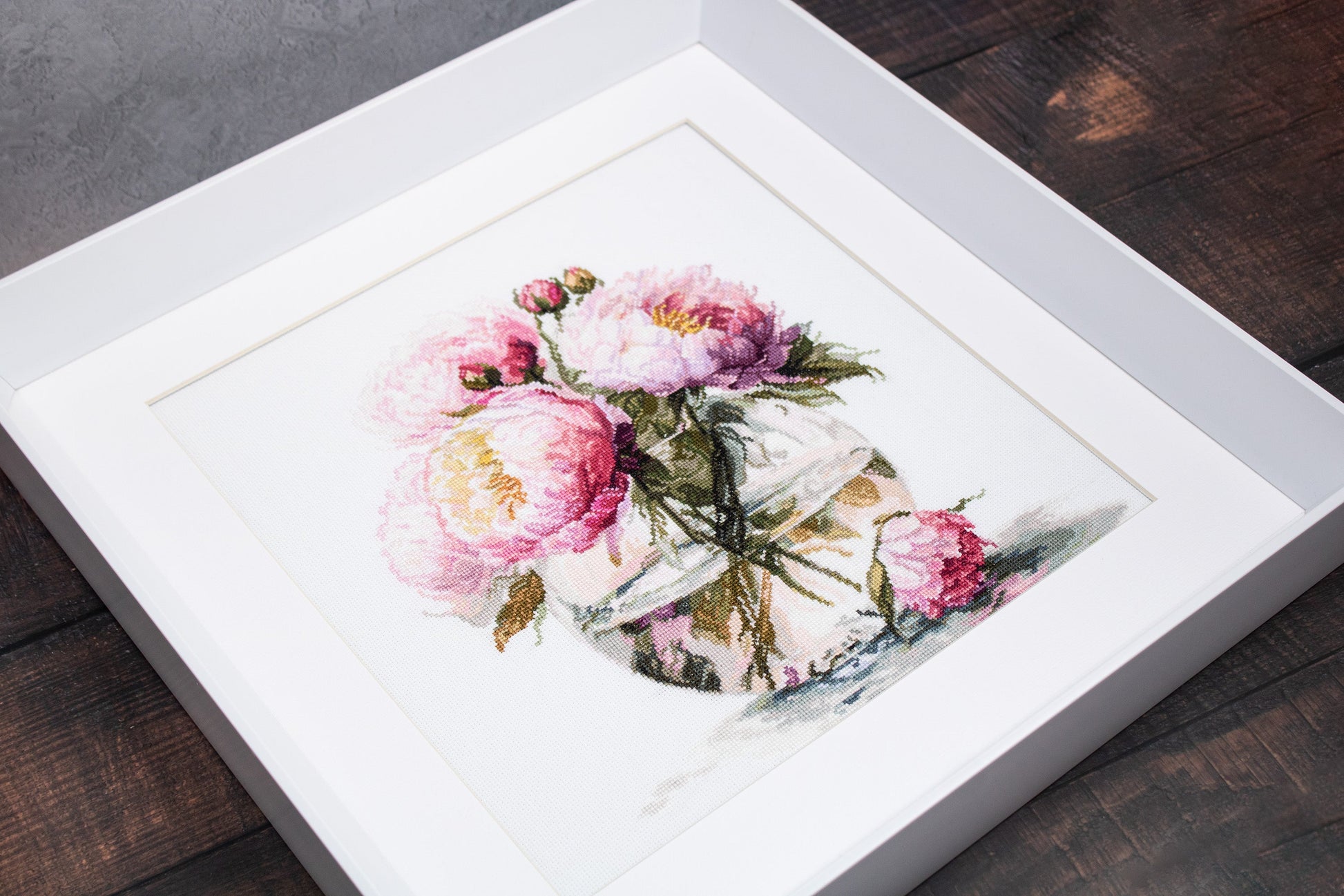 Angled view of framed Luca-S B7028 peonies cross stitch finished design
