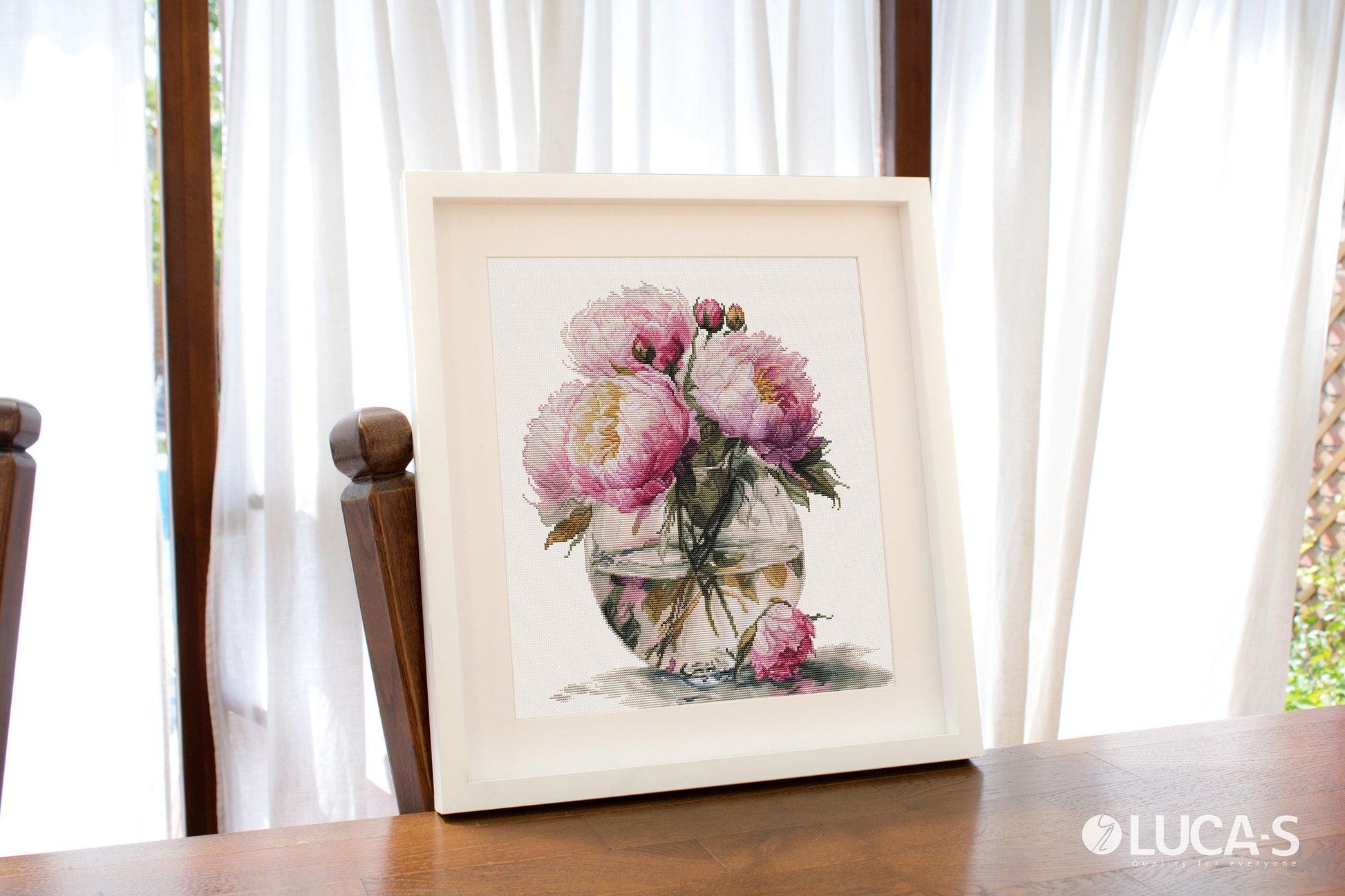 Luca-S Bouquet of Peonies B7028 framed cross stitch artwork by the window