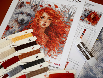 Dettaglio del kit ricamo AVA P049 – La ragazza dai capelli rossi e il lupo